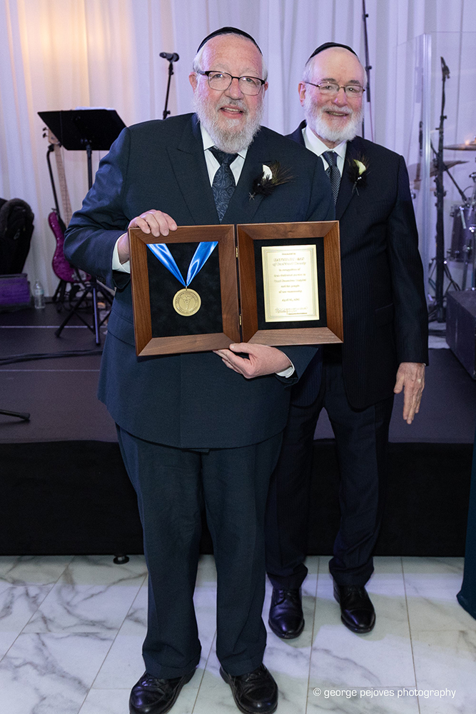 Heshe Greenzweig & Naftali Silberberg, Co-Presidents of Hatzoloh EMS, accept the Good Samaritan Hospital Medal of Honor.